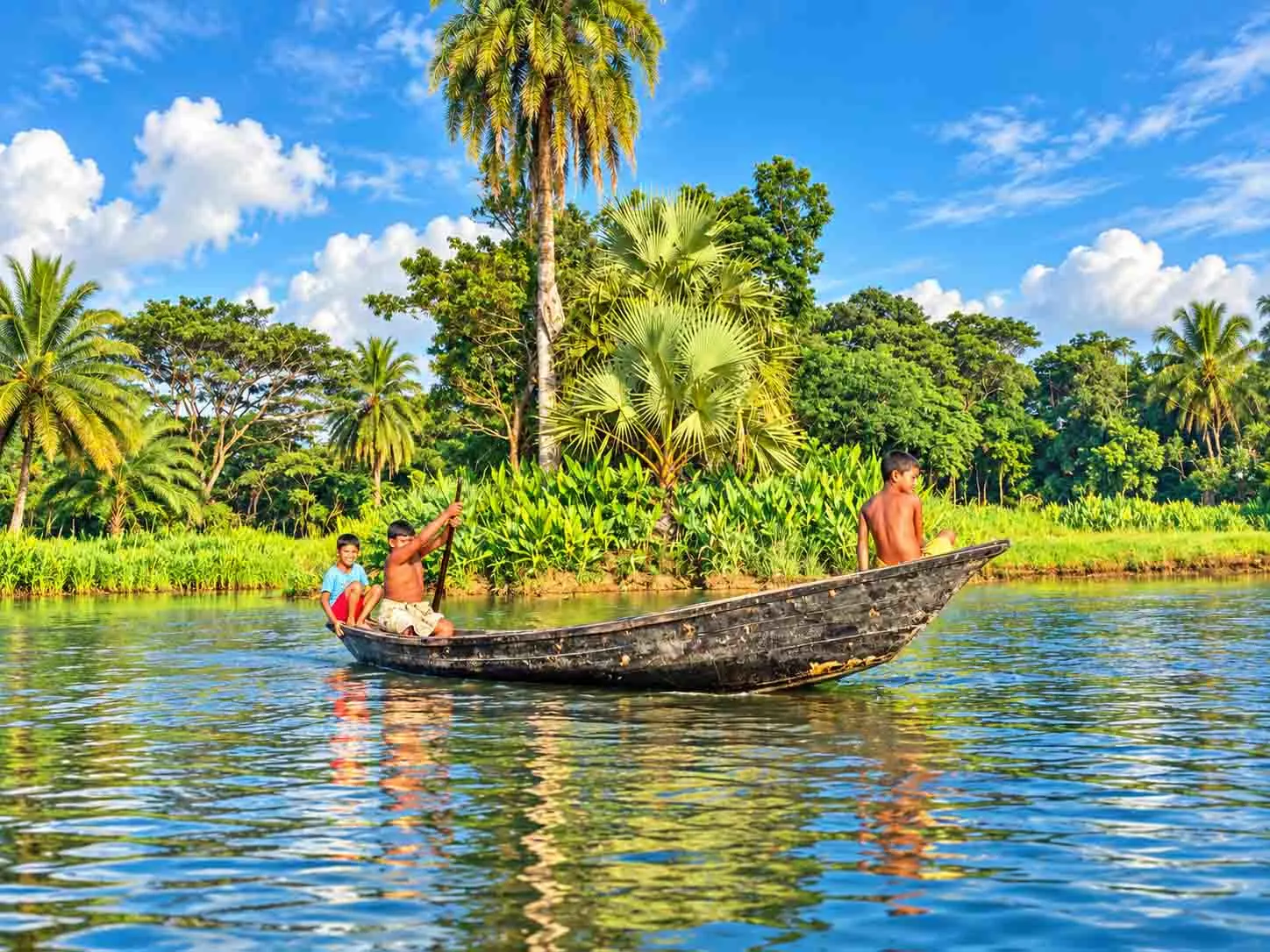 Village Children Rowing a Boat in Barishal Backwaters