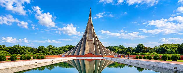 National Martyrs’ Memorial in Savar, Bangladesh, with its towering monument reflected in the surrounding water pool.